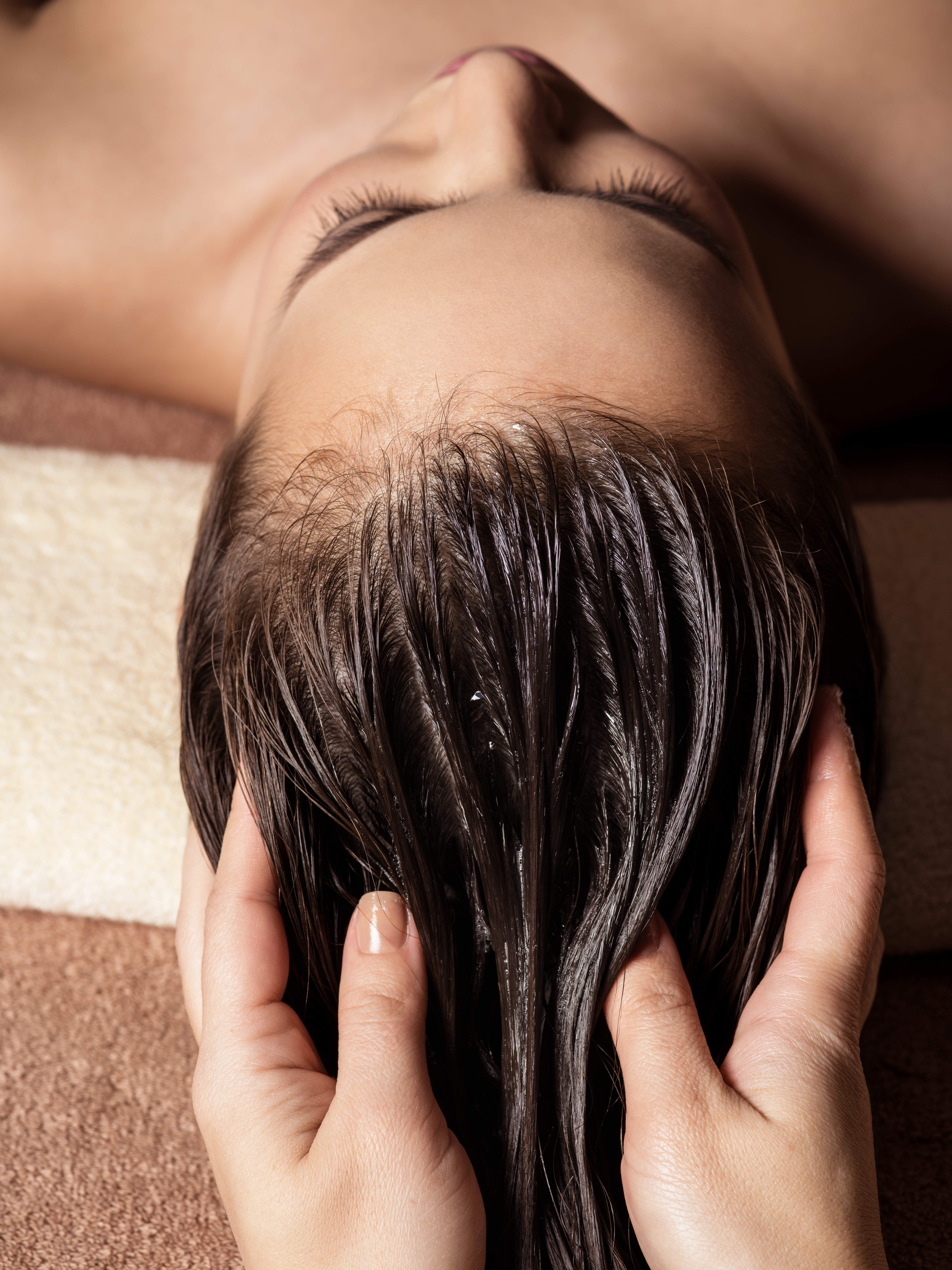 woman getting head massage, top-down view
